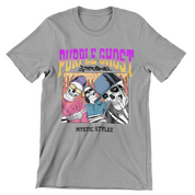 Grey crewneck shirt with Purple Ghost Apparel words above image. There are three skeletons of hip hop artists doing cool poses with fire behind them. One skeleton on the left is wearing a purple beanie with yellow lensed sunglasses. The skeleton in the middle has his arms crossed with black sunglasses and a blue collared shirt. The skeleton to the right has a baseball cap on, smiling with a grey shirt. All skeletons are enclosed by a box. The words Mystic Stylez at the bottom of the shirt, below the box.